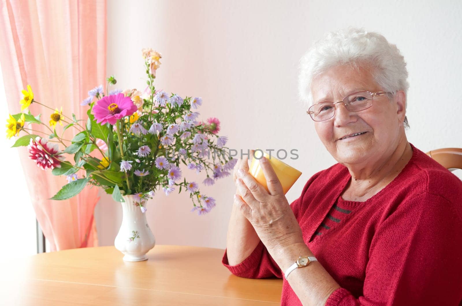 Senior woman with cup