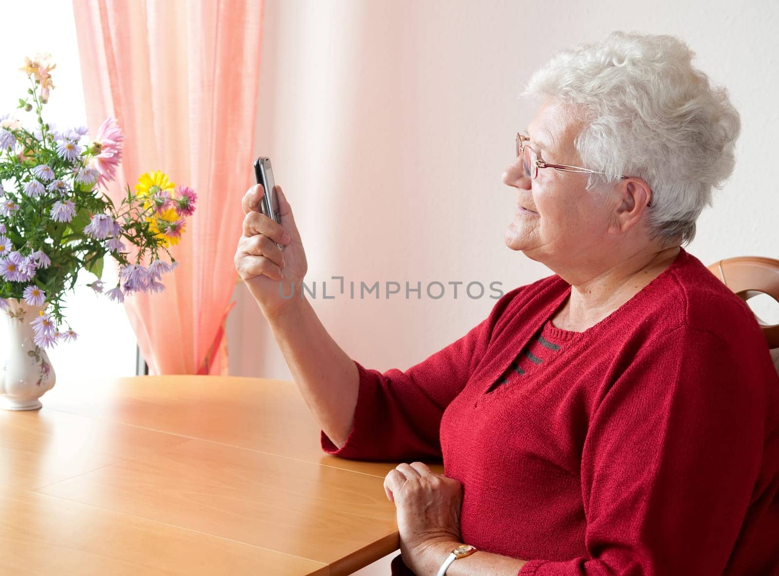 Senior woman reading text messages