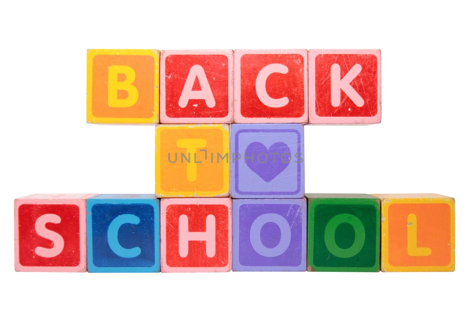 toy letters that spell back to school against a white background with clipping path