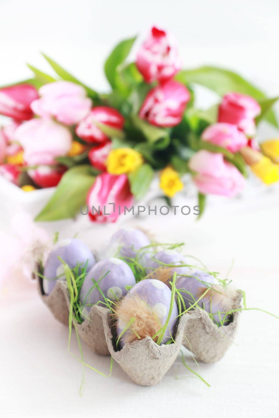 Easter eggs with tulips as table decoration