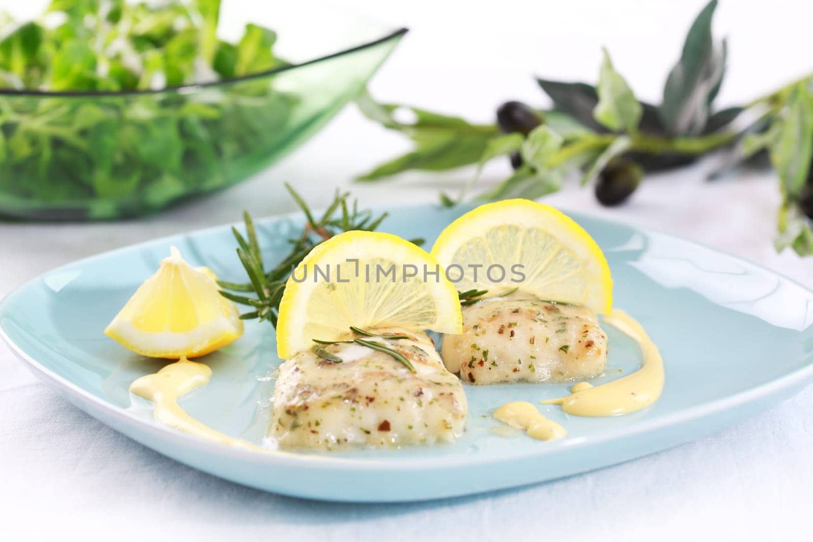 Baked hake with olive oil and rosemary
