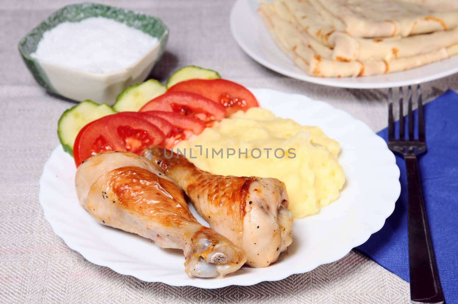 dinner of a potato and a chicken