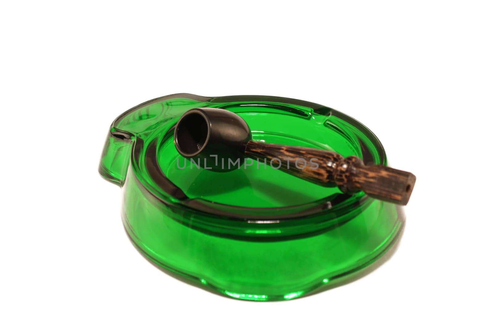 Ashtray and pipe on a white background