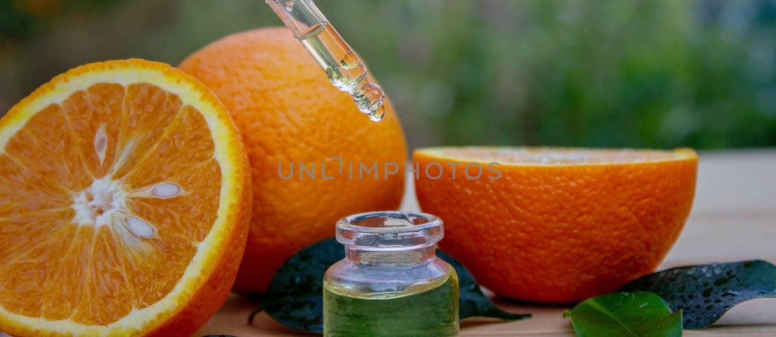 Essential oil extract of orange oil. Selective focus. by Anuta23