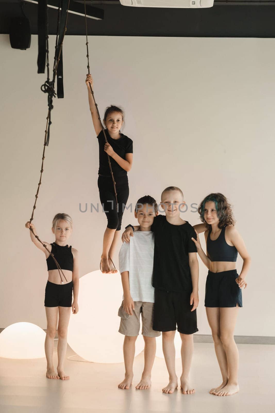 Portrait of a group of children in the fitness room. Children's yoga by Lobachad