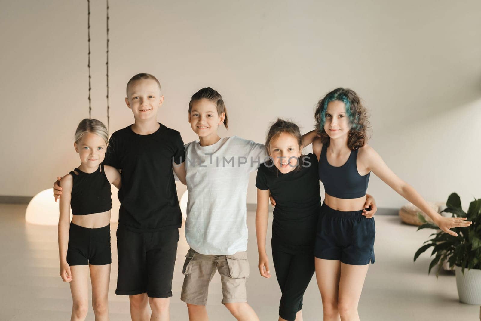 Portrait of a group of children in the fitness room. Children's yoga by Lobachad