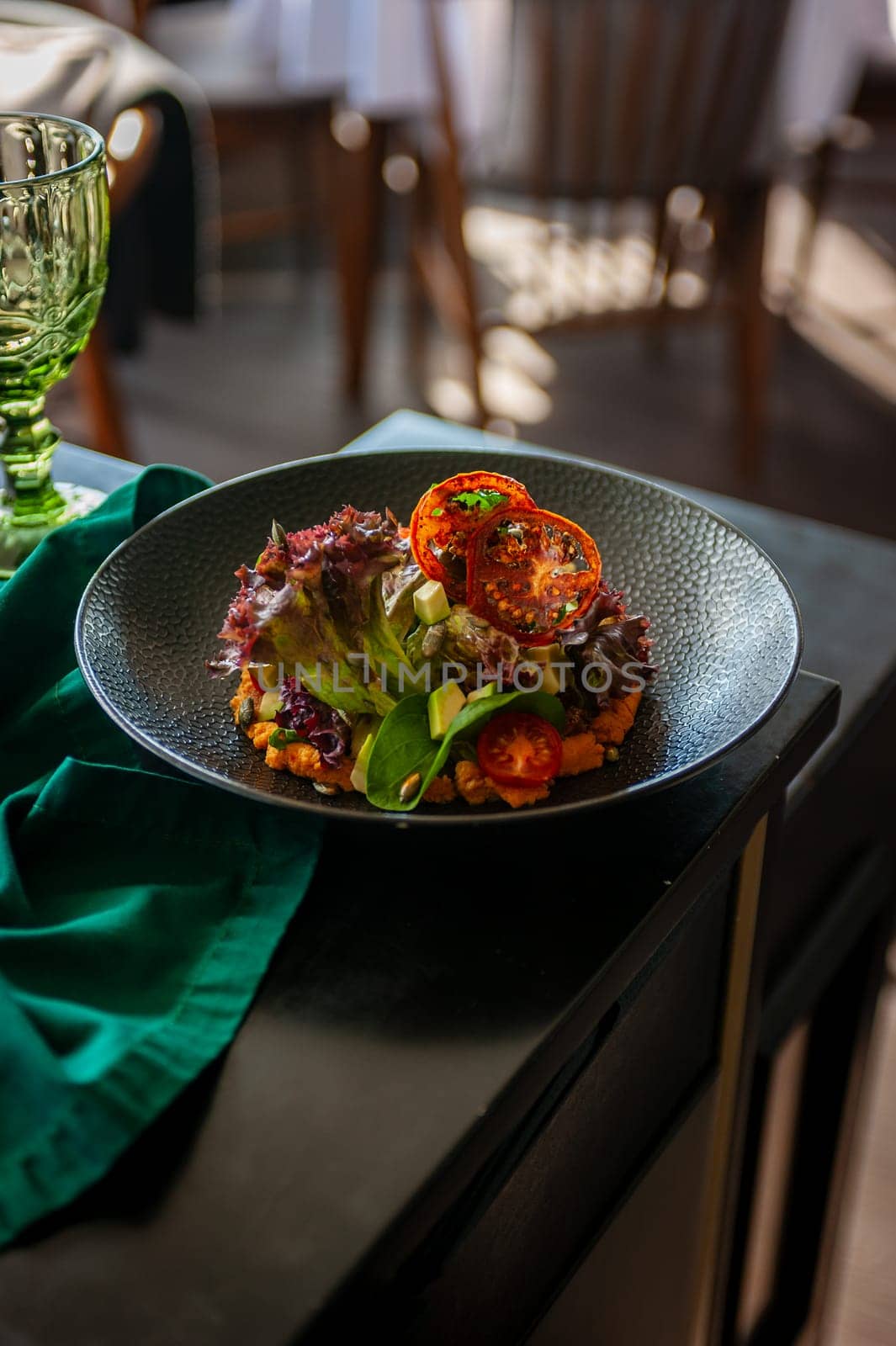 Vegetarian salad with avocado, basil, lettuce and cherry tomatoes. High quality photo