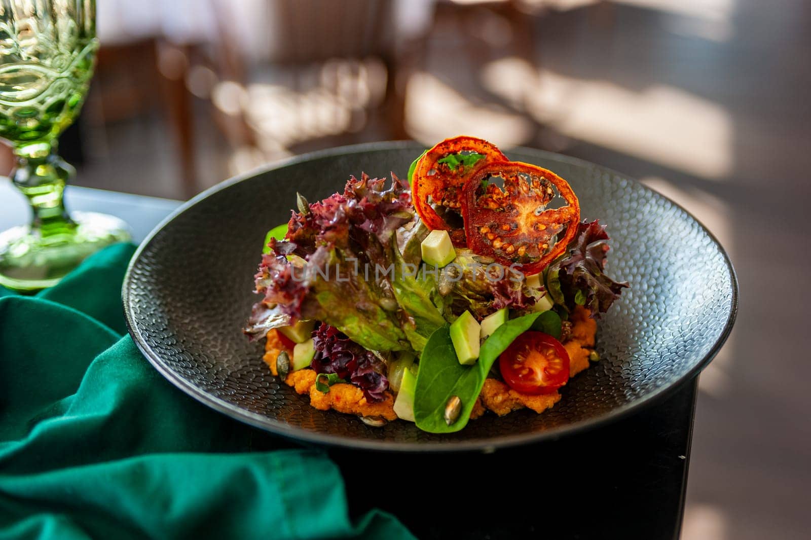 Vegetarian salad with avocado, basil, lettuce and cherry tomatoes. High quality photo