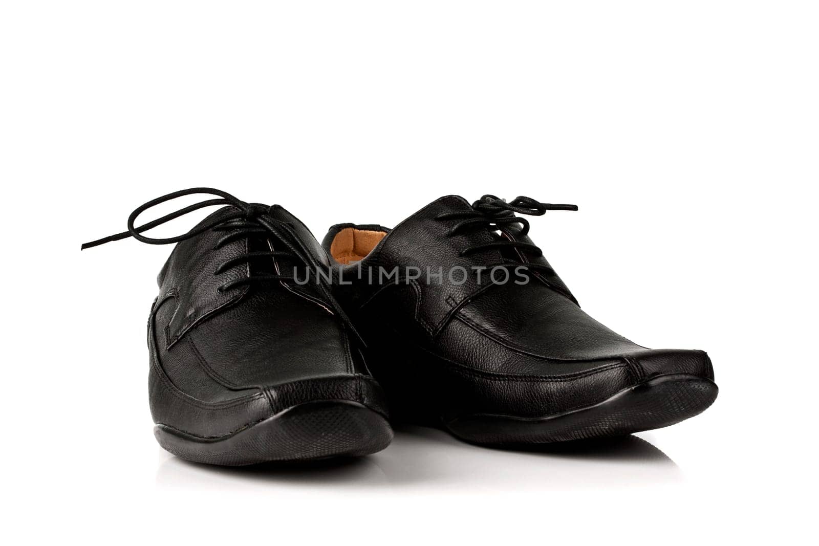 Elegant black leather men&#039 s shoes on white background with shadow.
