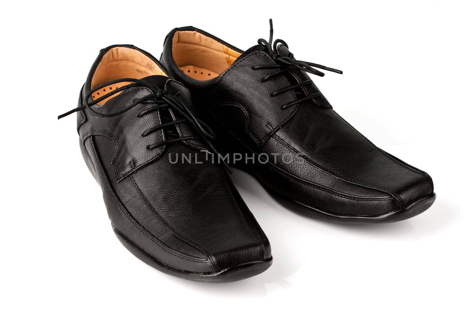 Elegant black leather men&#039 s shoes on white background with shadow.