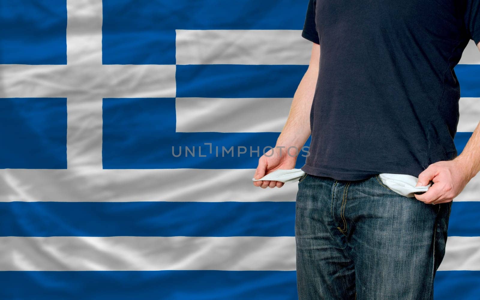 poor man showing empty pockets in front of greece flag