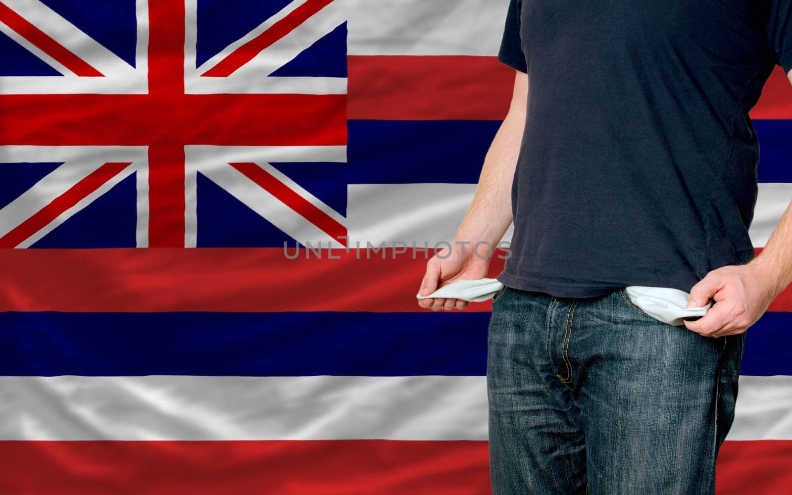 poor man showing empty pockets in front of american state of hawaii flag