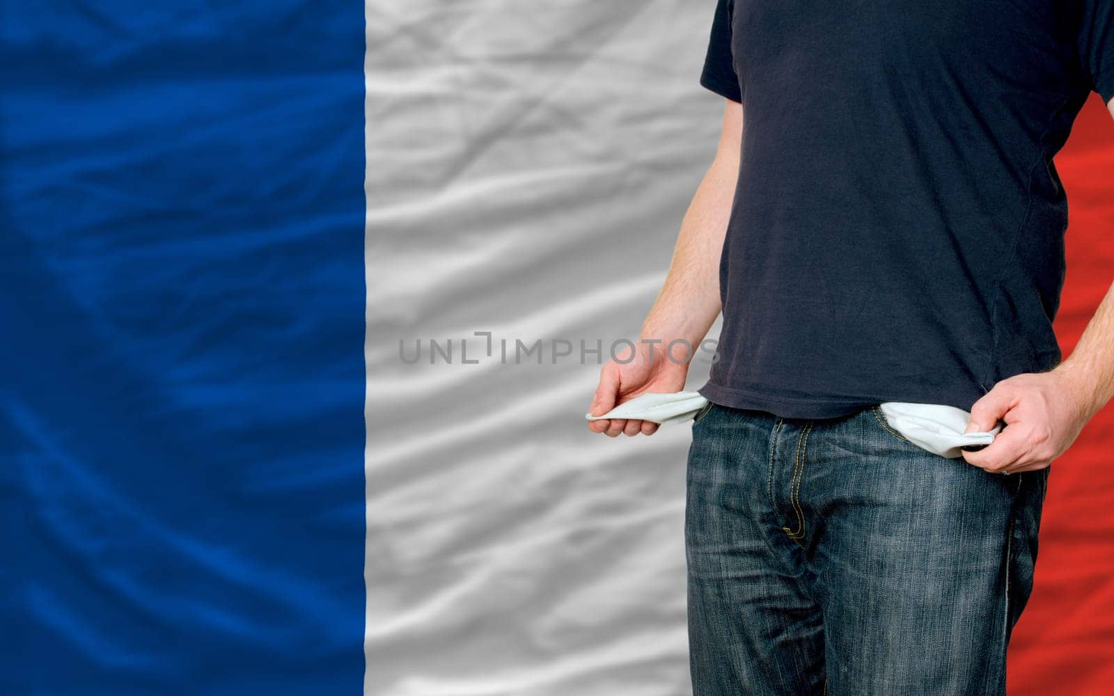 poor man showing empty pockets in front of france flag