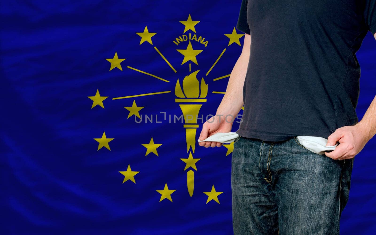 poor man showing empty pockets in front of american state of indiana flag