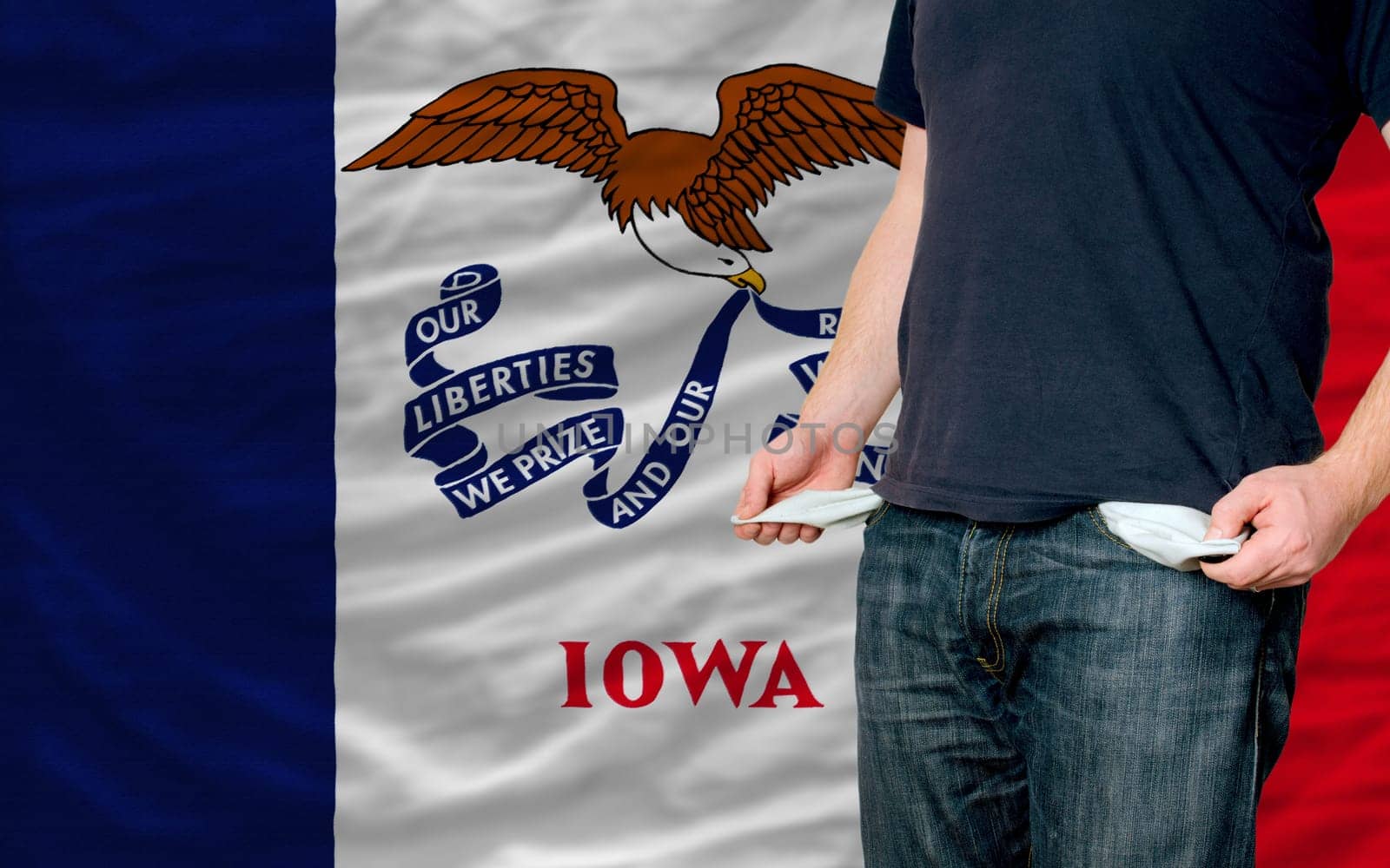poor man showing empty pockets in front of american state of iowa flag
