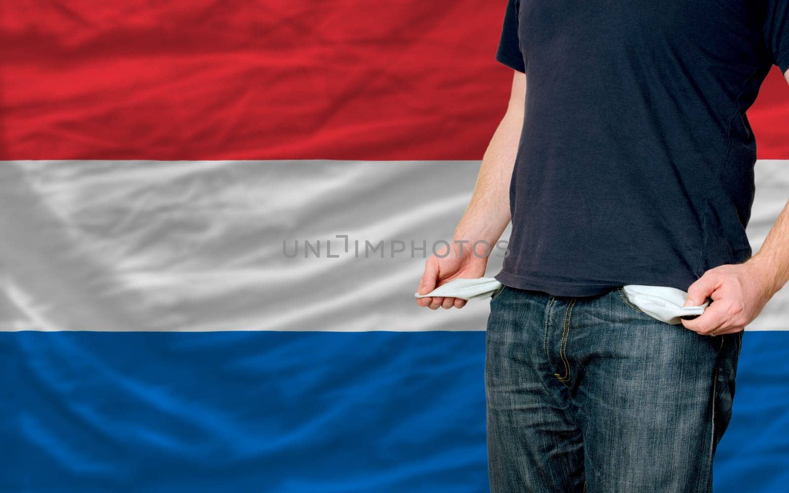 poor man showing empty pockets in front of netherlands flag