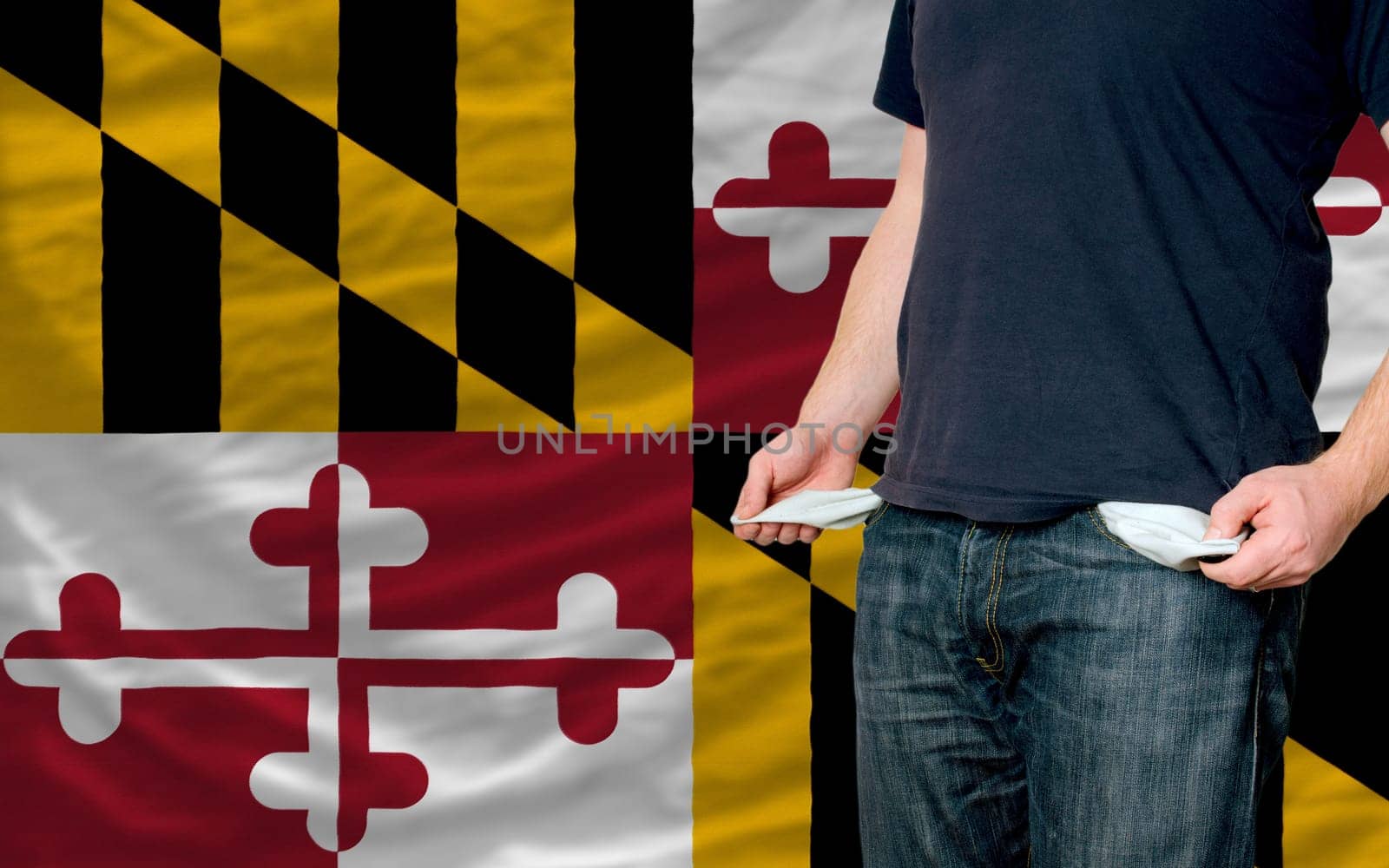 poor man showing empty pockets in front of american state of maryland flag