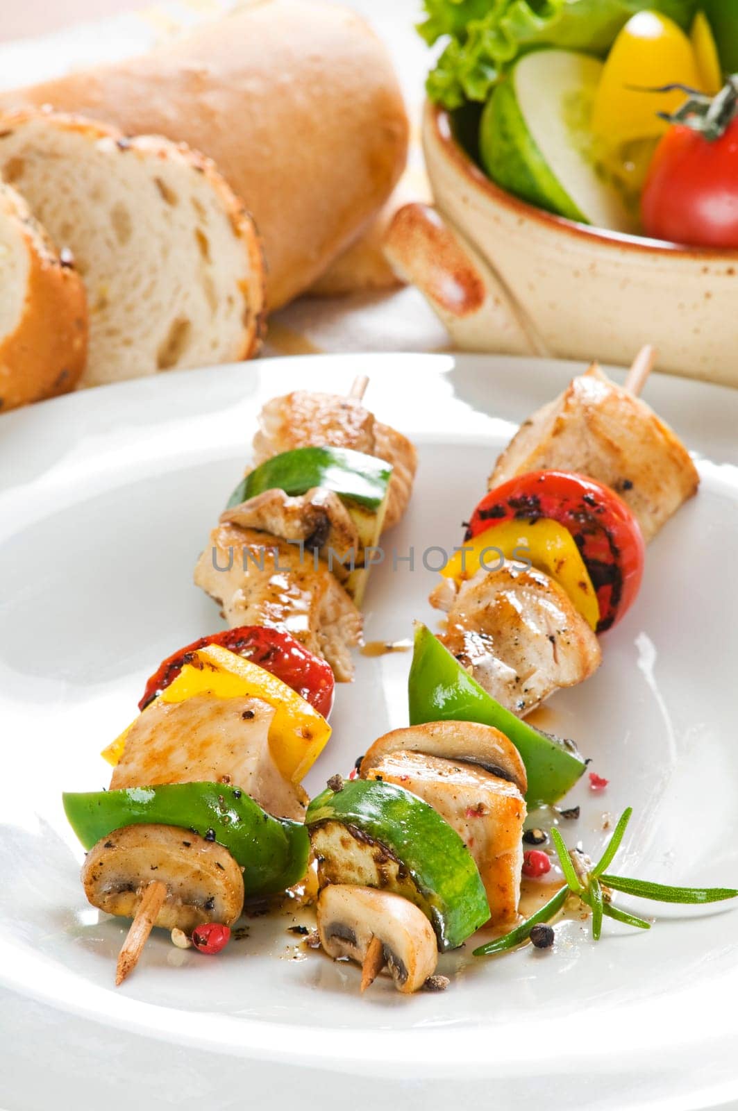 Grilled chicken with vegetables on stick close up
