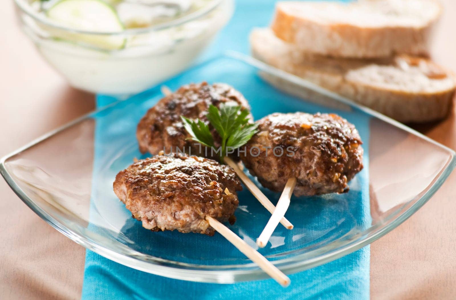 Beef meat balls with tzaziki sauce close up