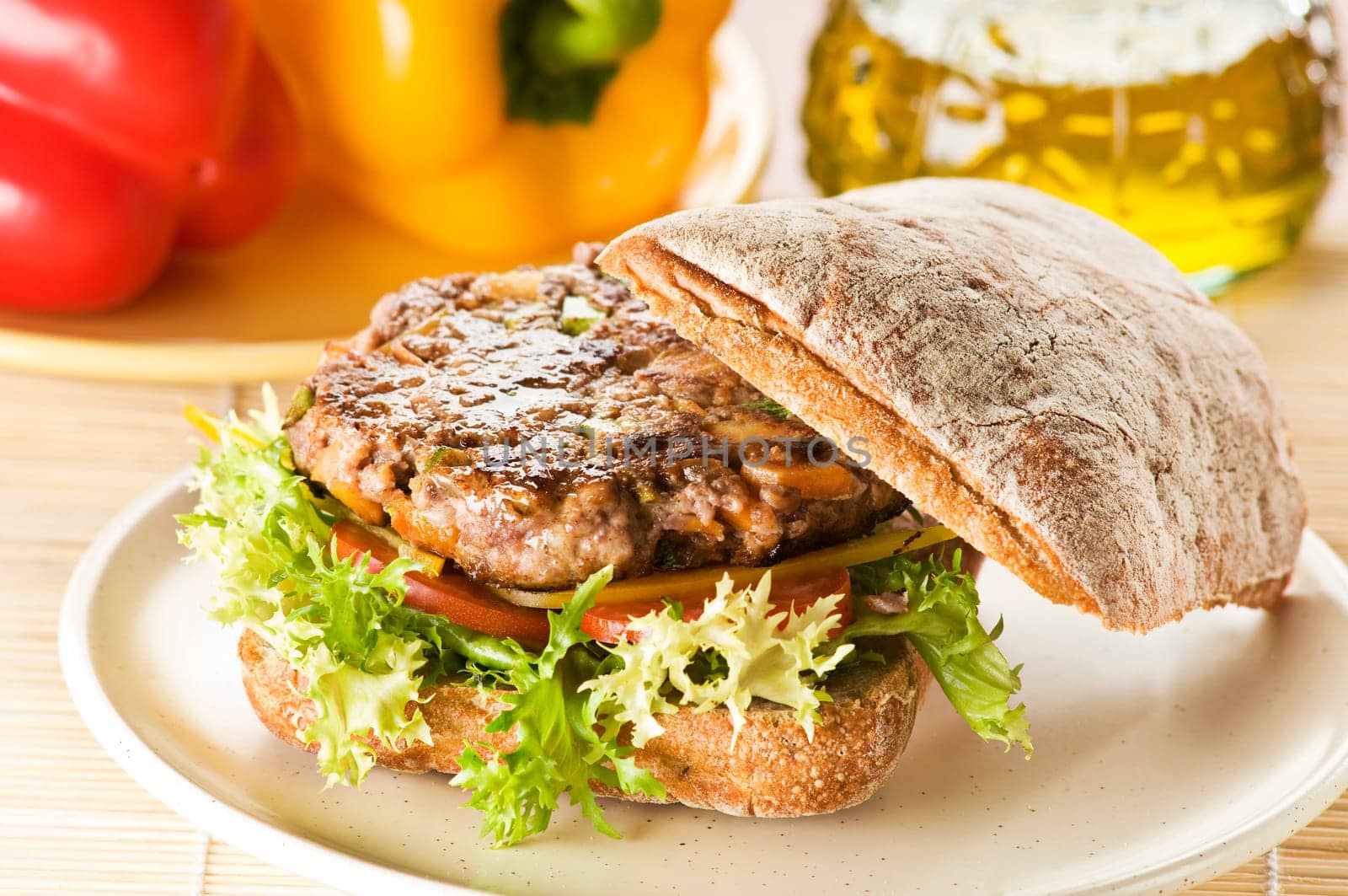 Sandwich with beef steak, salad and tomato close up