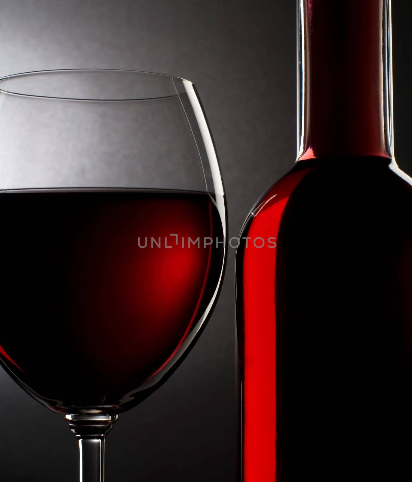 Red wine in glass and bottle close up