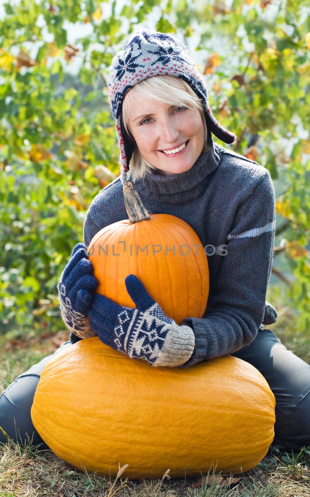 Young woman with orange pumpkin close up shoot