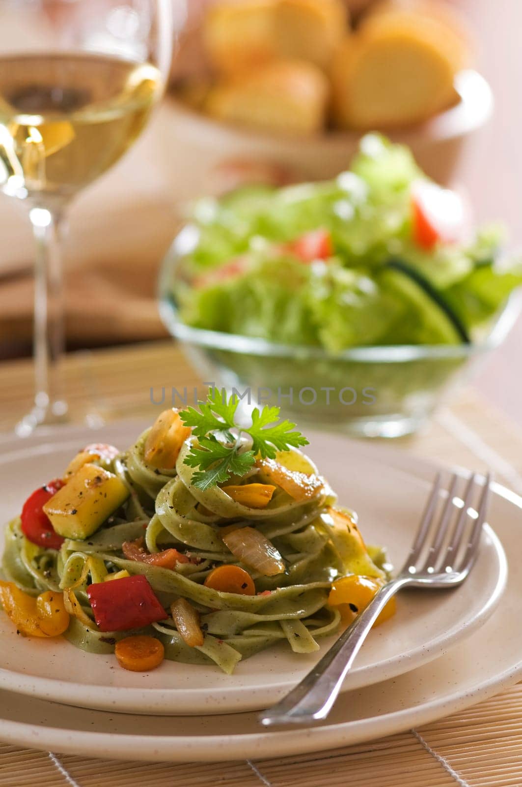 Fresh pasta salad with roasted vegetables close up