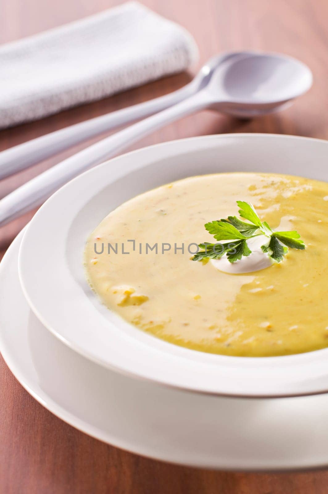 Fresh hot orange pumpkin soup close up
