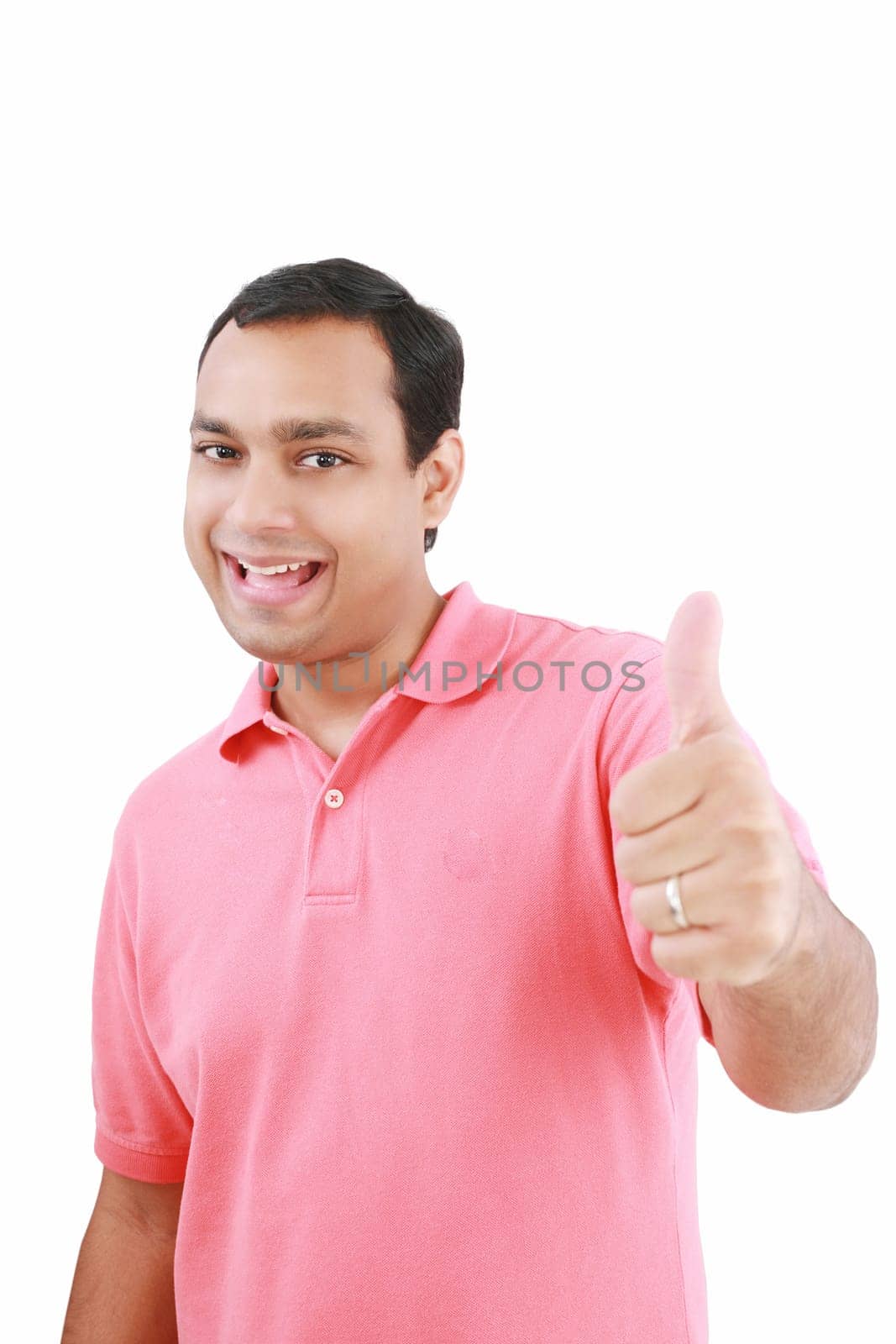 Portrait of a happy young man showing good job sign against white background