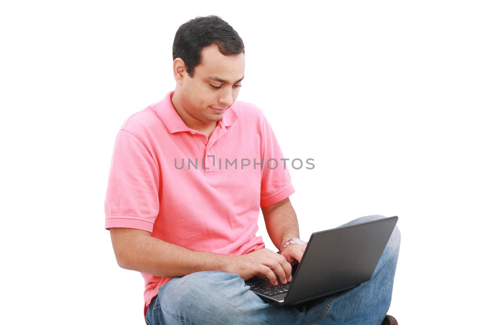 Young man sitting on the floor and work with laptop computer