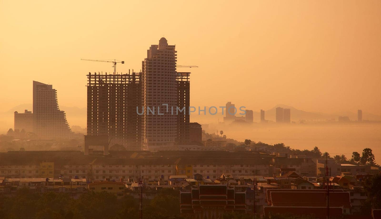 Skyscraper in vibrant colors. Building on the sunset.