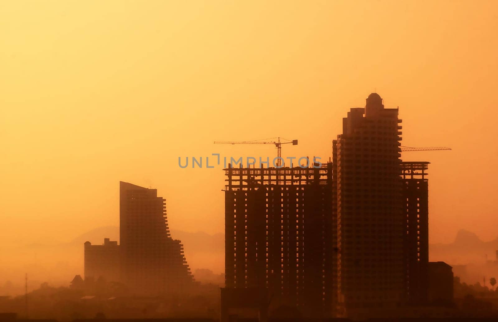 Skyscraper in vibrant colors. Building on the sunset.
