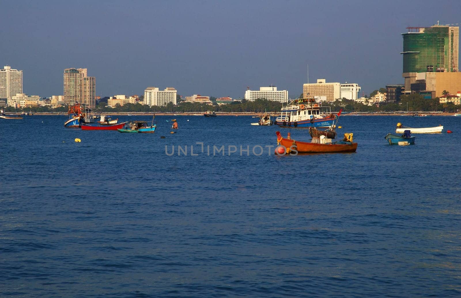 Boats, buildings, beach  modern seacoast urban landscape.