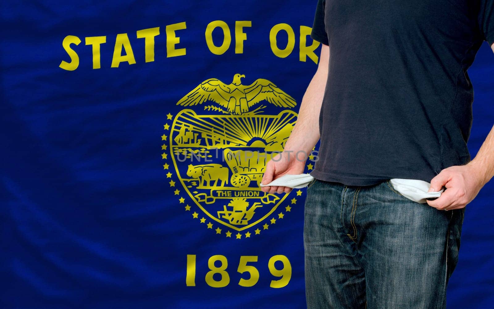 poor man showing empty pockets in front of american state of oregon flag