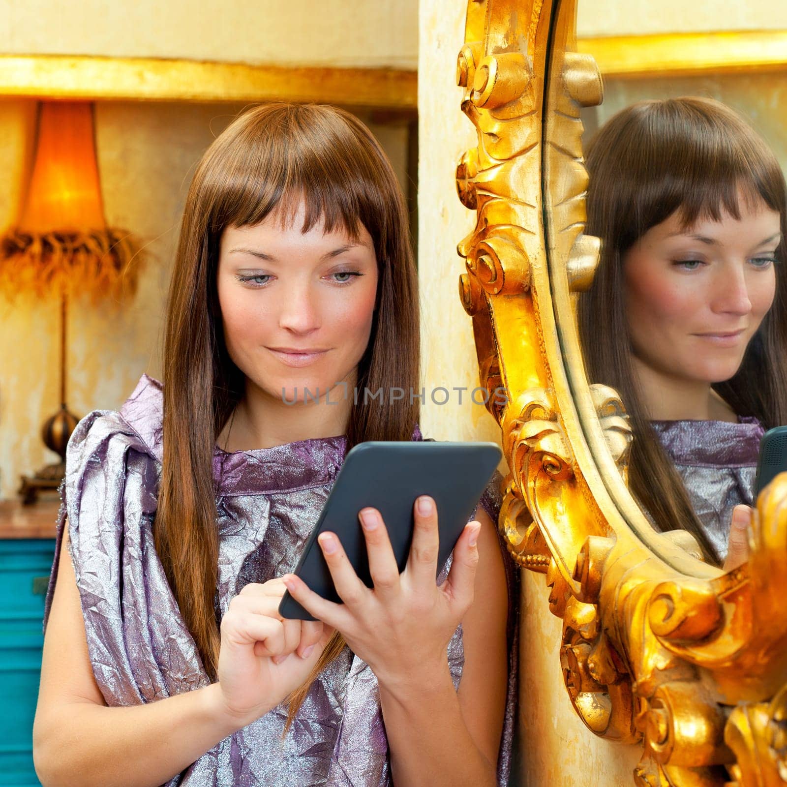 fashion woman reading ebook tablet in vintage grunge house