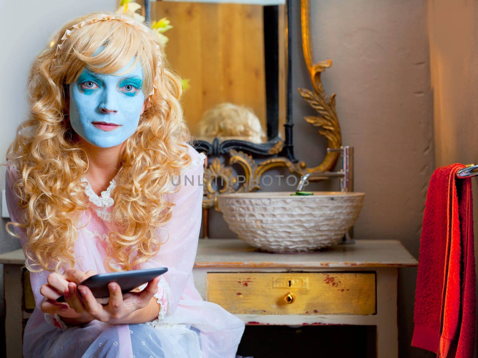 Humor woman in bathroom with ebook tablet and green mask