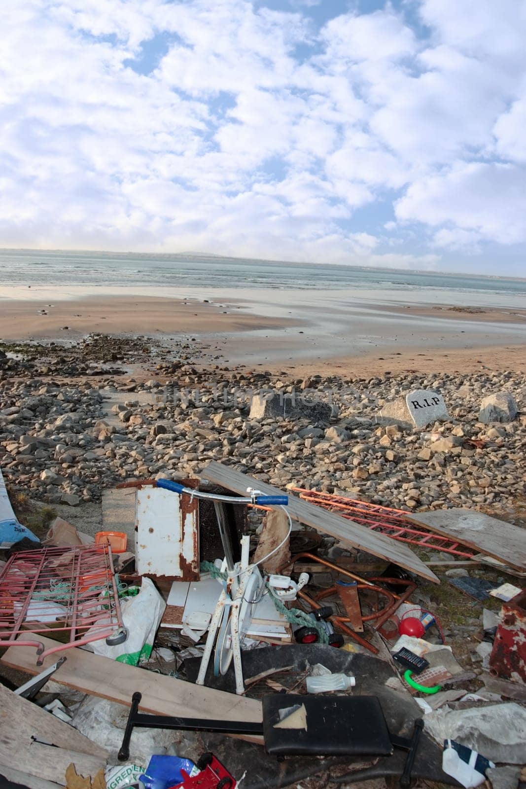 waste dumped on a scenic beach