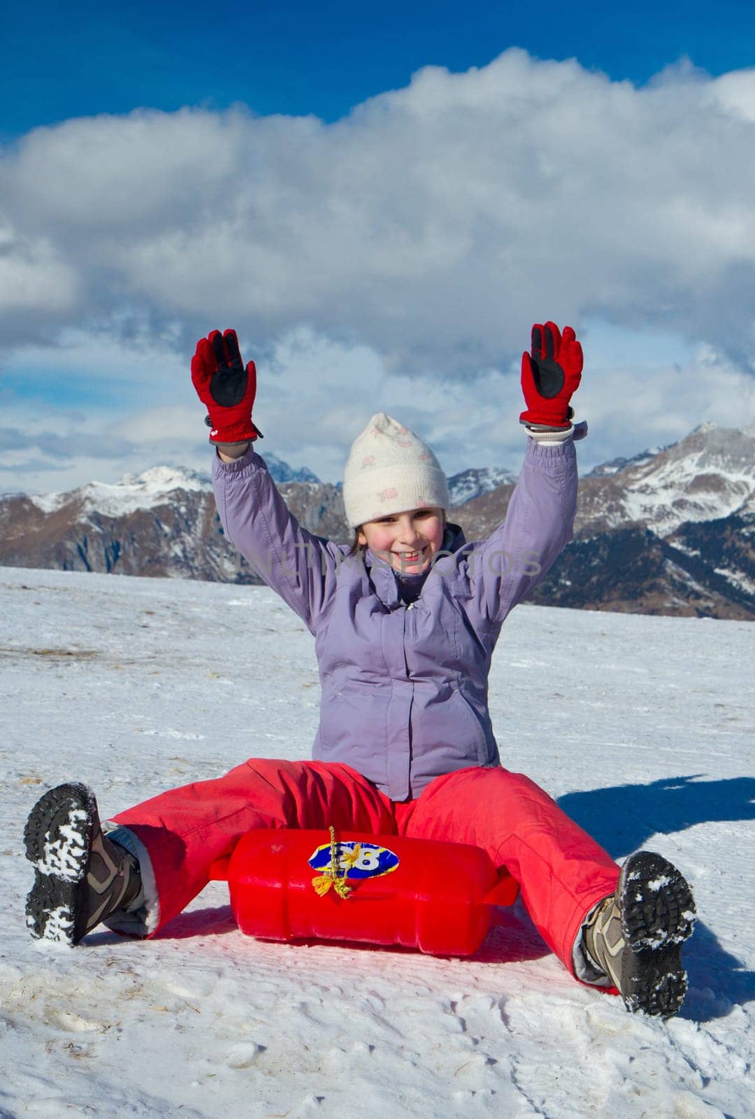 A girl sliding in the snow