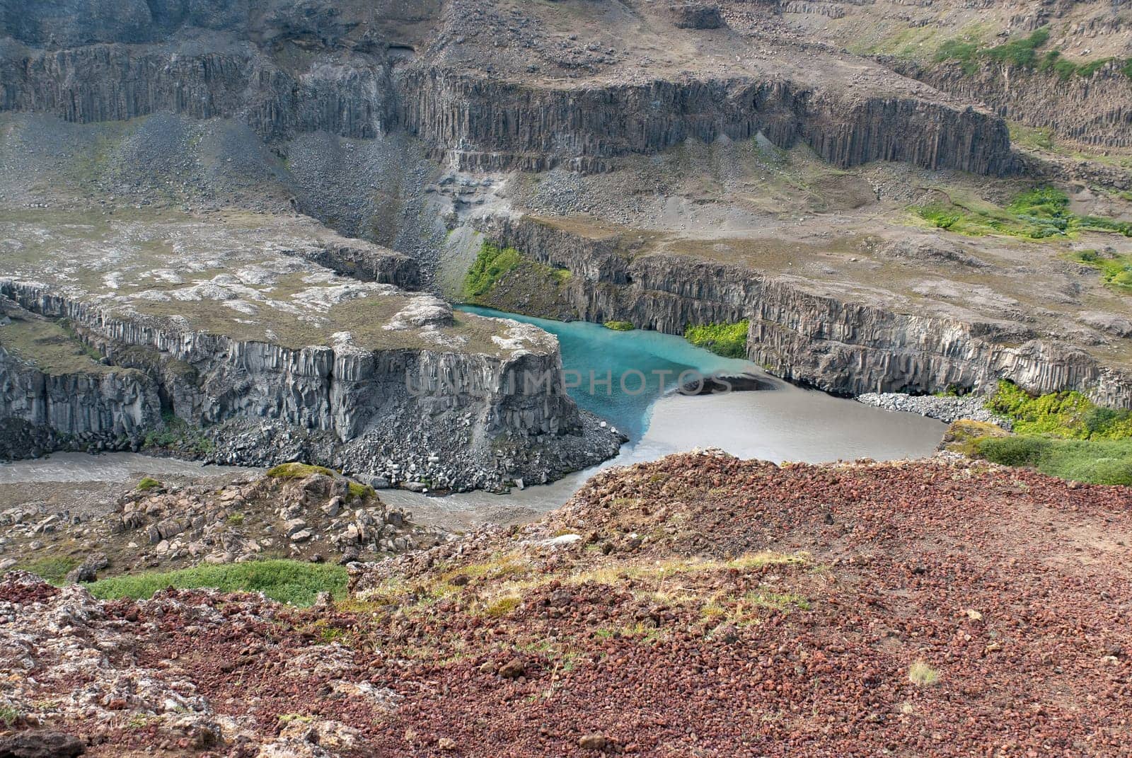 meeting of two rivers downstream from the Dettifoss waterfall in Iceland