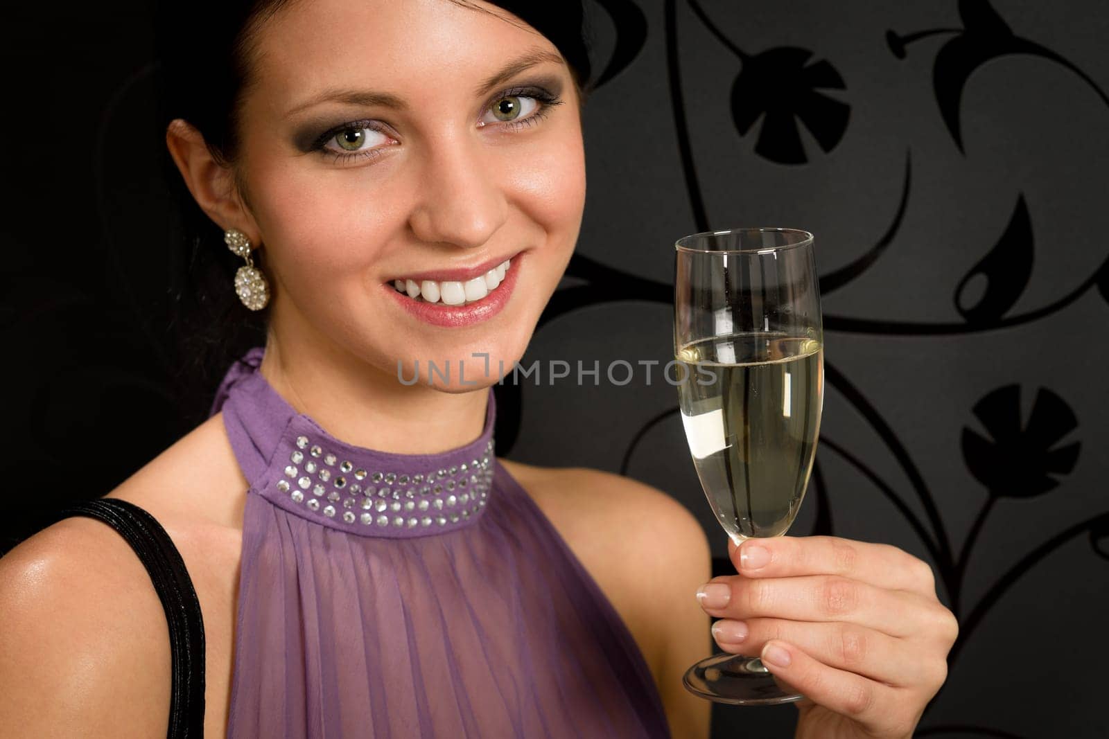 Woman party dress toasting champagne glass drink glamorous look camera