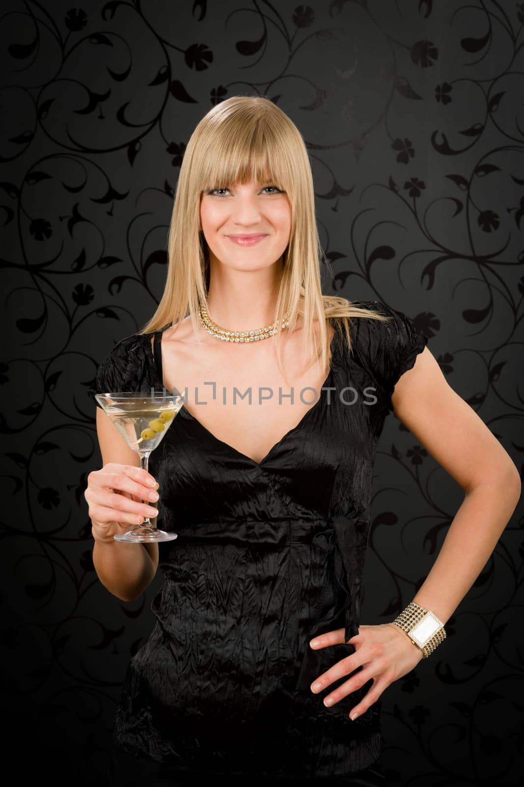 Woman party dress hold cocktail glass smiling looking at camera
