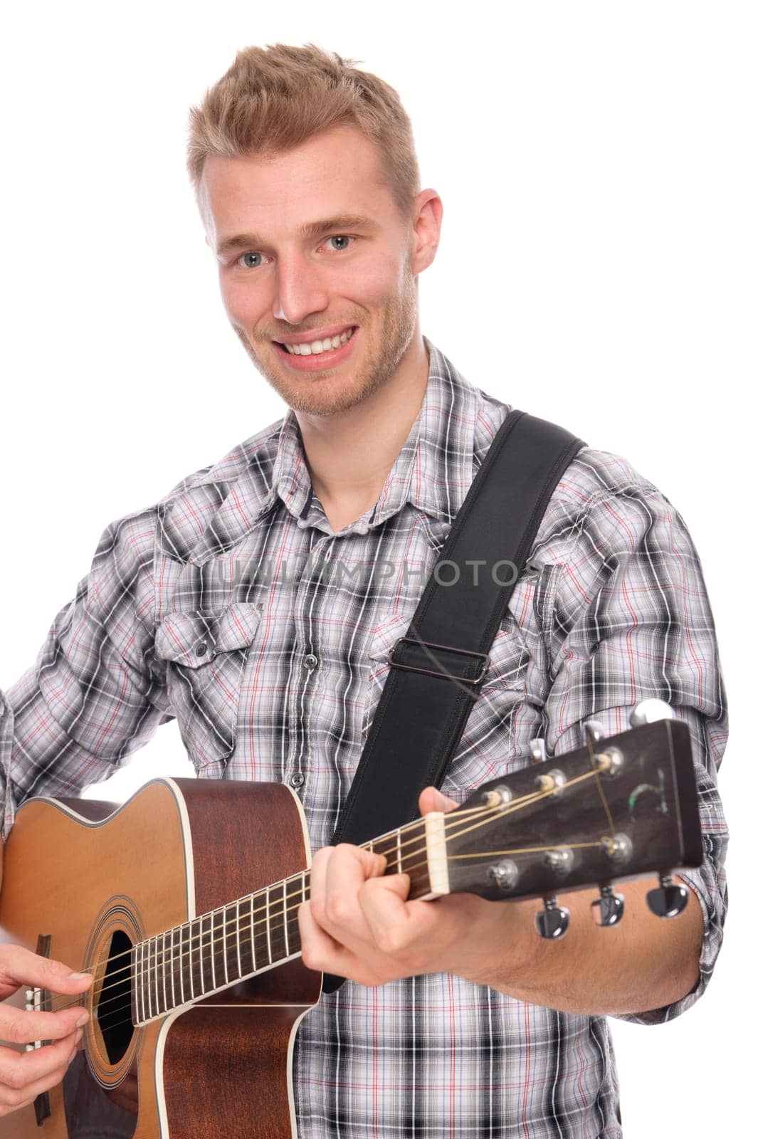 Studio shot of a young man with a guitar