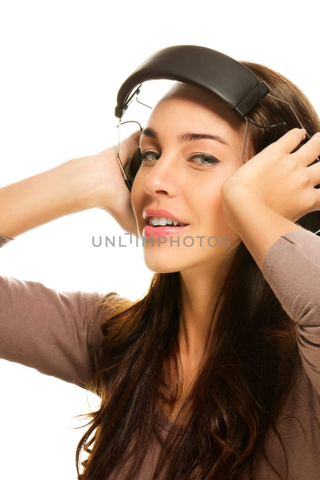 Young woman with headphones on white background