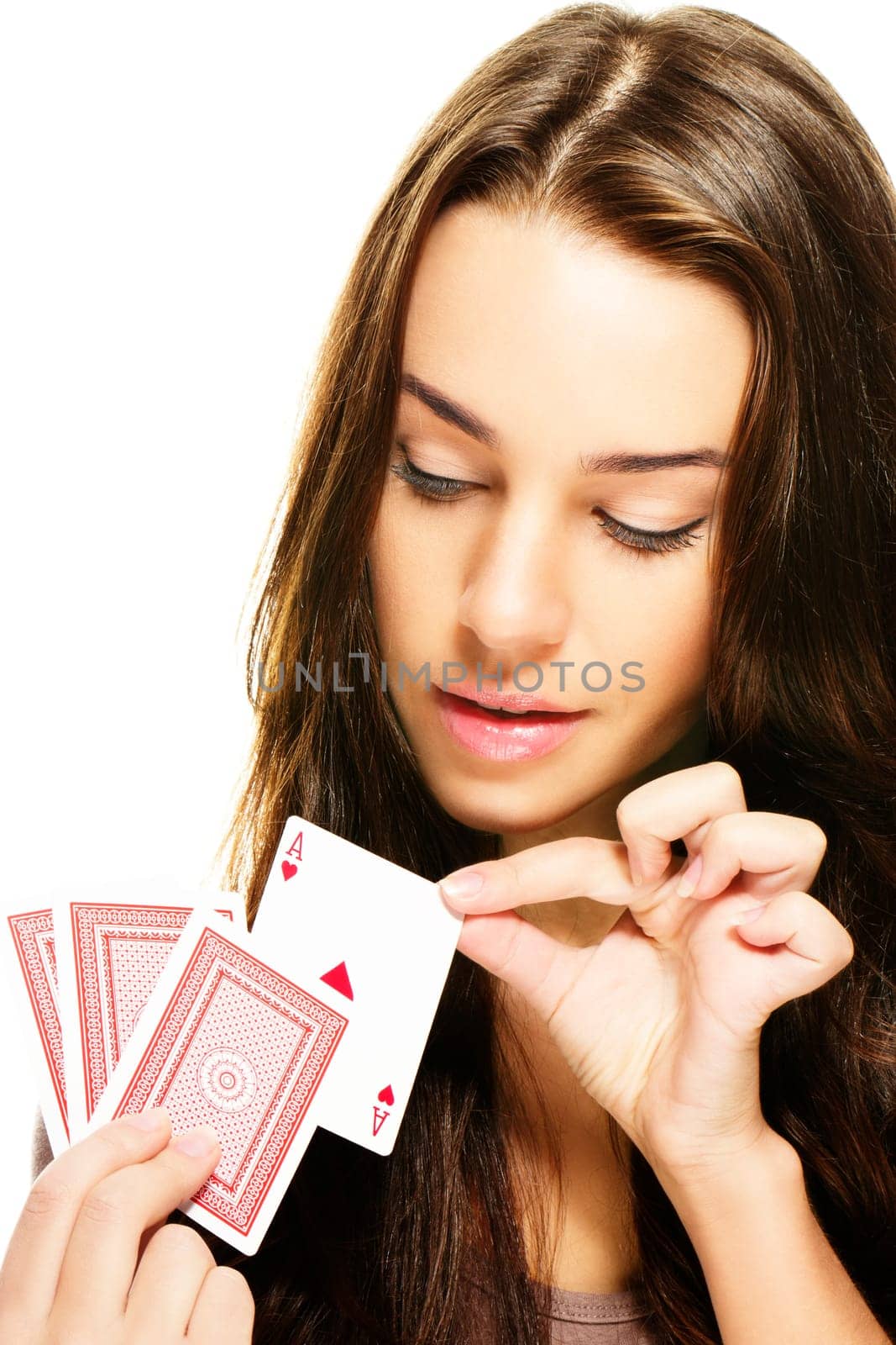Young beautiful woman choosing a poker card on white background