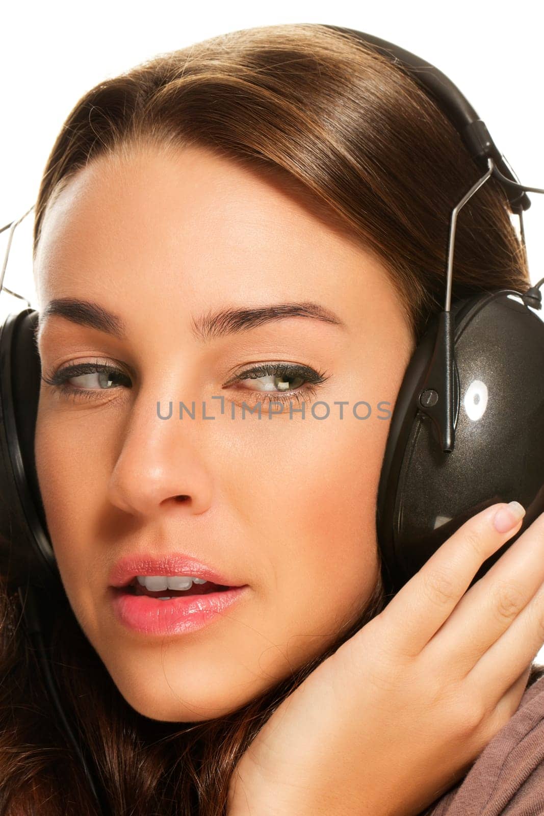 Close-up of a young woman listening to music