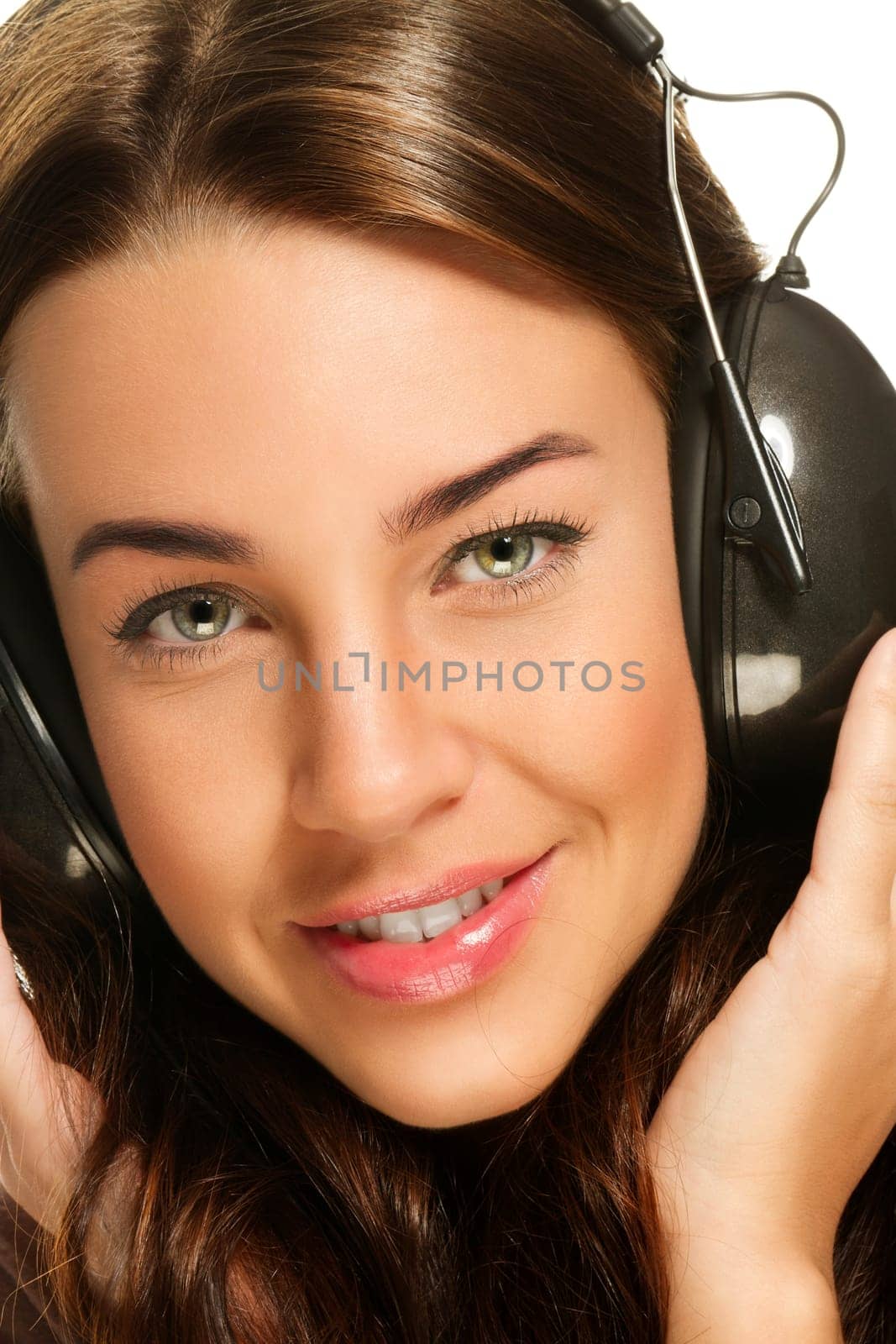 Happy young woman listening to music