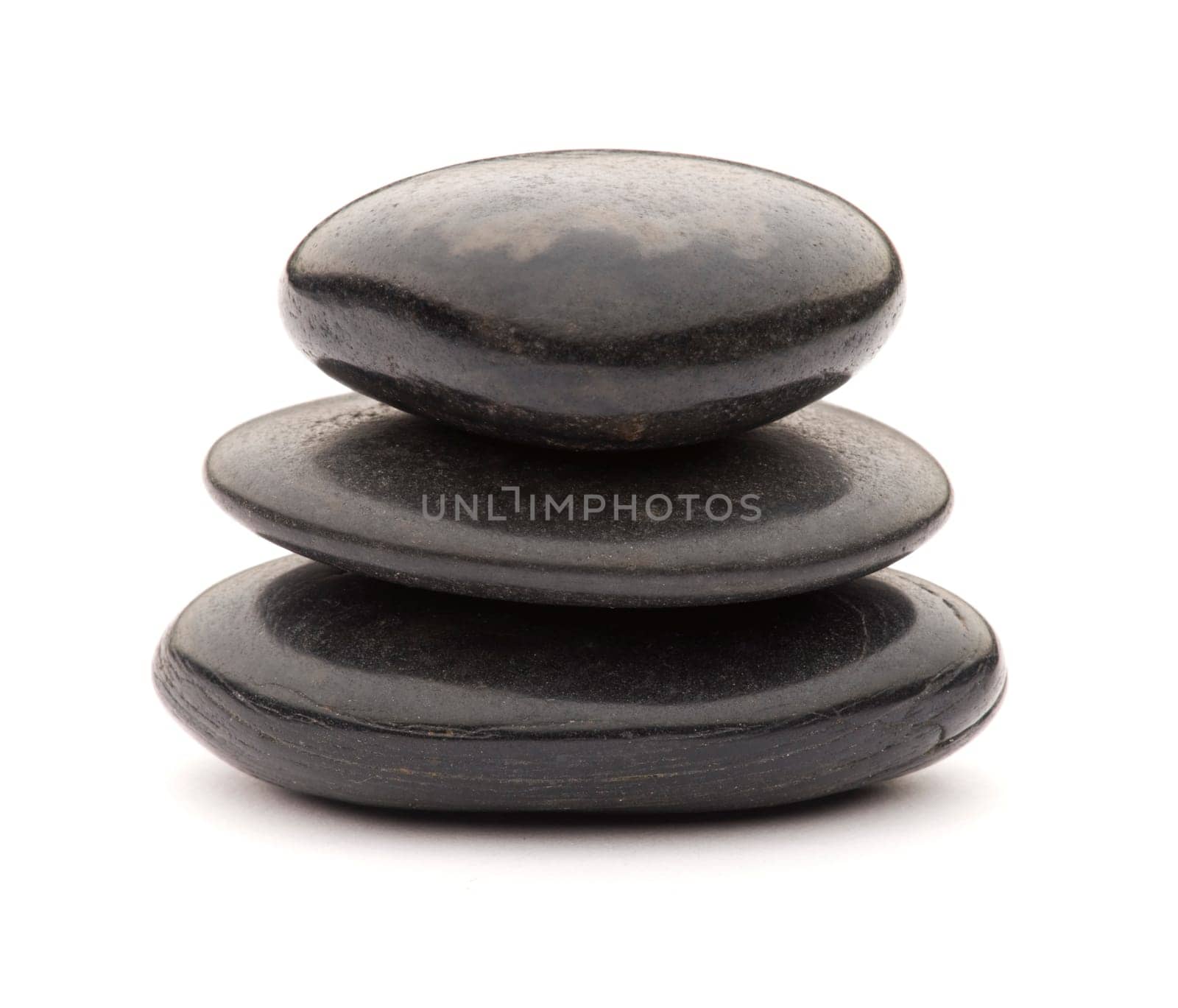 Black spa stones isolated on white close up