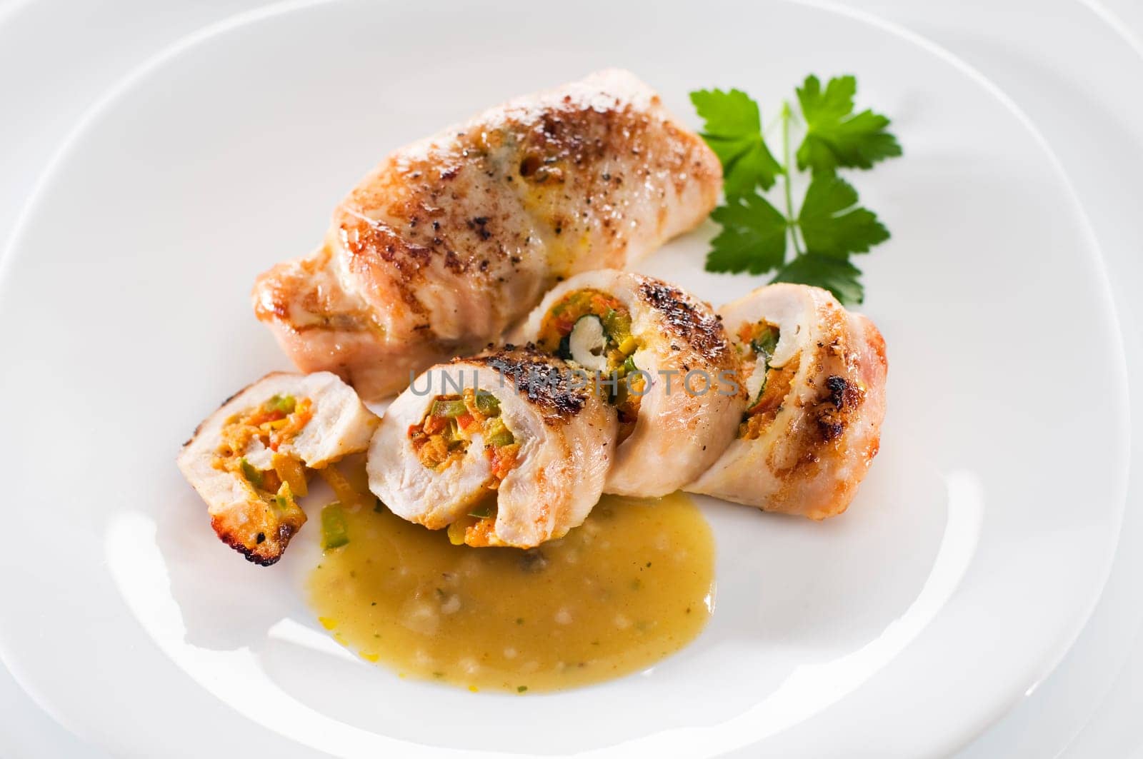 Stuffed chicken rolls with rice close up shoot