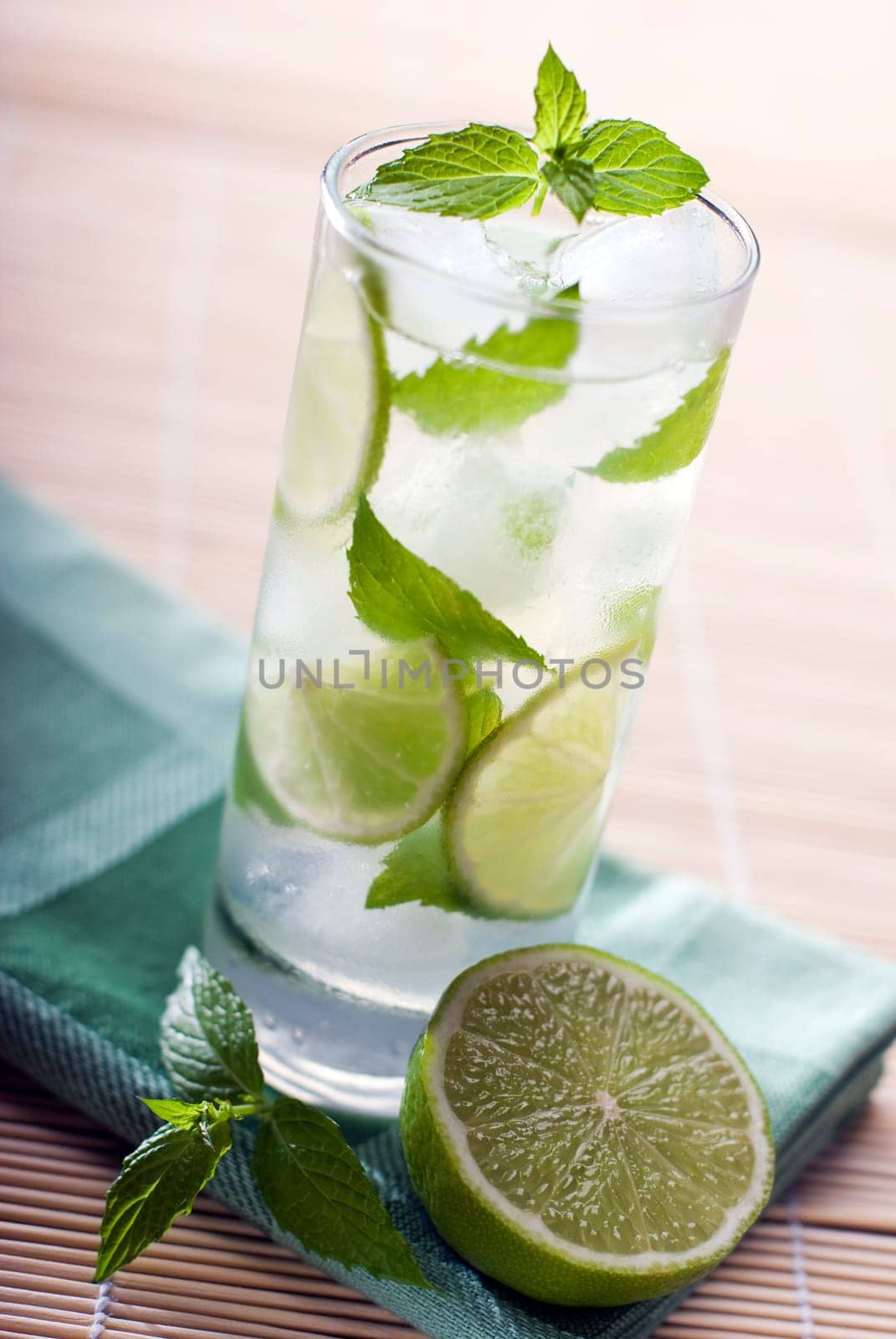 Fresh mojito with lime and mint close up