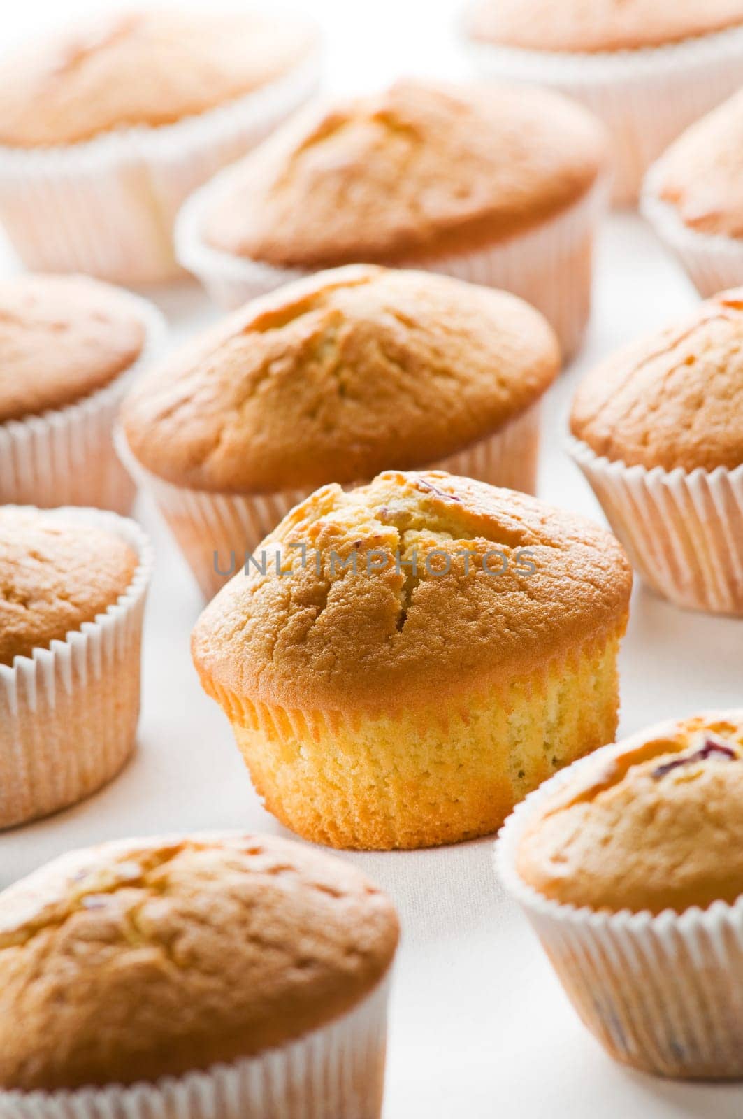 Freshly baked yellow muffins close up shoot